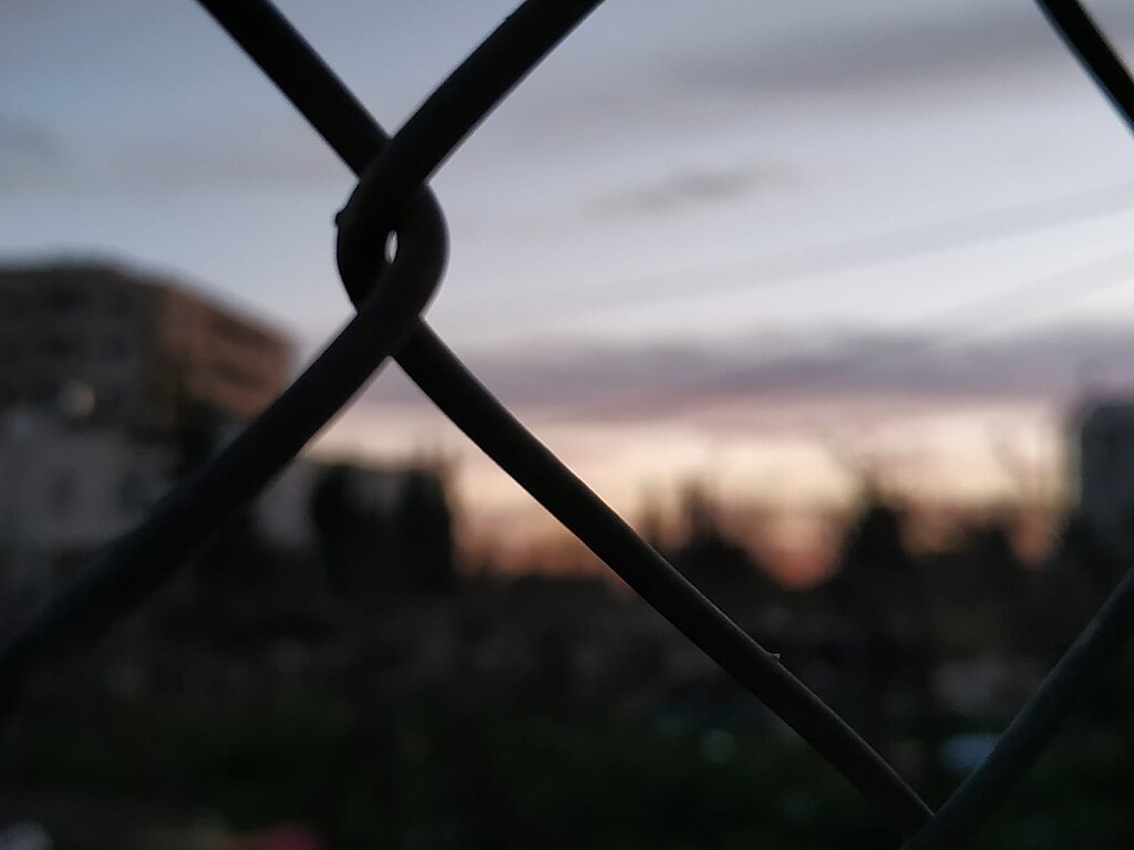 London, U.K, March 2019, building site fence panels for a Louis